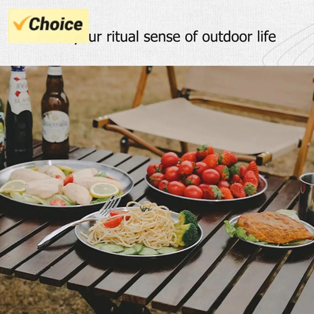 Stainless steel plates at an outdoor meal — serving suggestion